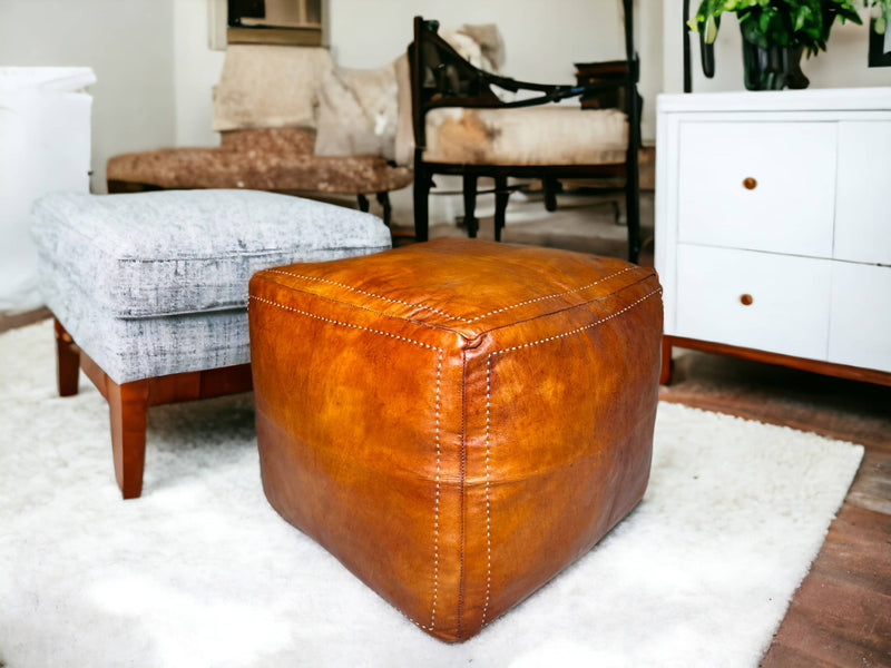 Tabacco Square Moroccan Pouf: A Treasure of Berber Artisanship - handmade by Moroccantastics - Affordable pouf, Berber craftsmanship, Eco-friendly pouf, leather work, Moroccan décor, Moroccan furniture, Moroccan pouf, square pouf, Timeless pouf, Tobacco square pouf, Unmodified photographs, Versatile pouf