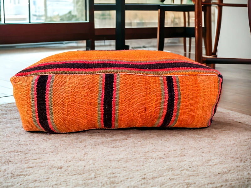 Authentic Moroccan charm in every thread. Unstuffed Berber rug pouf, crafted from 100% wool for warmth and comfort. A historic touch with a Moroccan pattern, ready for your personalization. Smooth zipper for easy customization. Embrace the authenticity delivered to your doorstep.