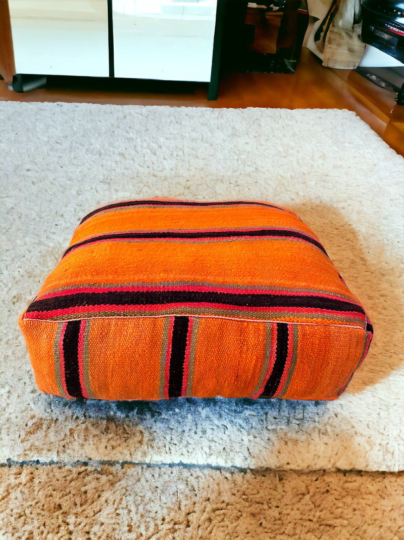 Authentic Moroccan charm in every thread. Unstuffed Berber rug pouf, crafted from 100% wool for warmth and comfort. A historic touch with a Moroccan pattern, ready for your personalization. Smooth zipper for easy customization. Embrace the authenticity delivered to your doorstep.