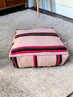 Authentic Moroccan charm in every thread. Unstuffed Berber rug pouf, crafted from 100% wool for warmth and comfort. A historic touch with a Moroccan pattern, ready for your personalization. Smooth zipper for easy customization. Embrace the authenticity delivered to your doorstep.