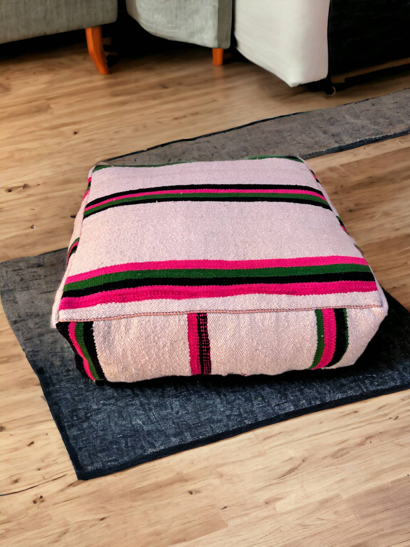 Authentic Moroccan charm in every thread. Unstuffed Berber rug pouf, crafted from 100% wool for warmth and comfort. A historic touch with a Moroccan pattern, ready for your personalization. Smooth zipper for easy customization. Embrace the authenticity delivered to your doorstep.