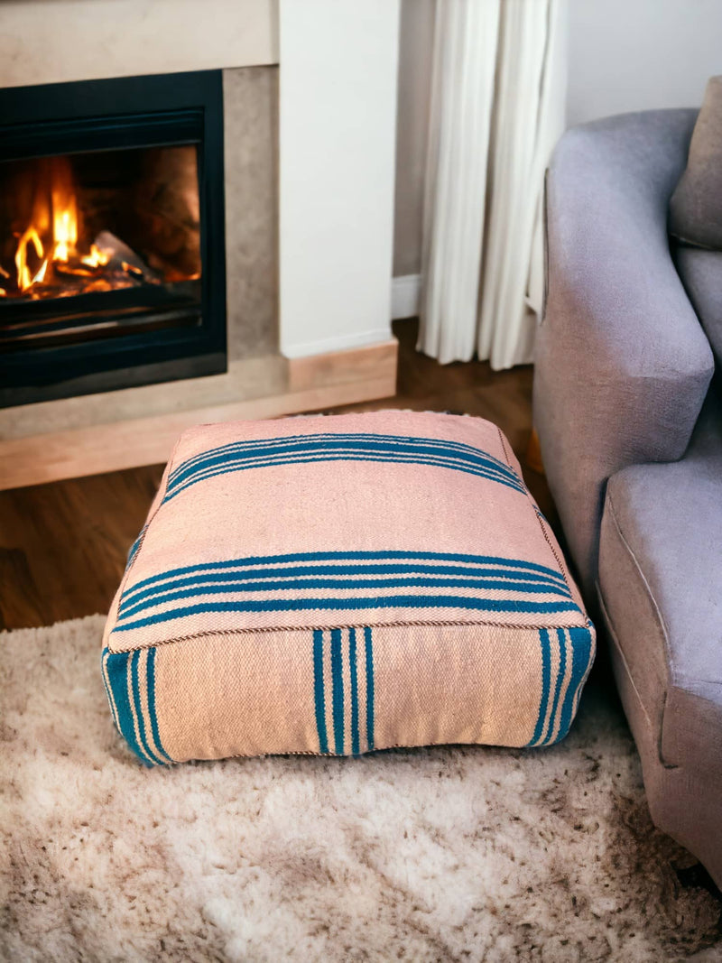 Authentic Moroccan charm in every thread. Unstuffed Berber rug pouf, crafted from 100% wool for warmth and comfort. A historic touch with a Moroccan pattern, ready for your personalization. Smooth zipper for easy customization. Embrace the authenticity delivered to your doorstep.