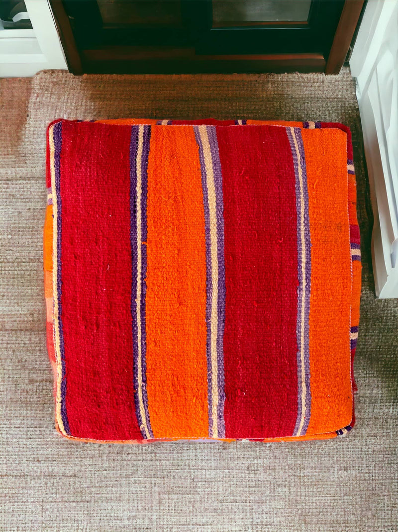 Authentic Moroccan charm in every thread. Unstuffed Berber rug pouf, crafted from 100% wool for warmth and comfort. A historic touch with a Moroccan pattern, ready for your personalization. Smooth zipper for easy customization. Embrace the authenticity delivered to your doorstep.