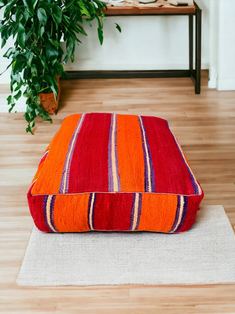 Authentic Moroccan charm in every thread. Unstuffed Berber rug pouf, crafted from 100% wool for warmth and comfort. A historic touch with a Moroccan pattern, ready for your personalization. Smooth zipper for easy customization. Embrace the authenticity delivered to your doorstep.