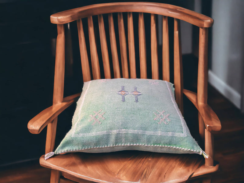 Handmade lumbar cushion with intricate Moroccan Sabra design, perfect for home decor.