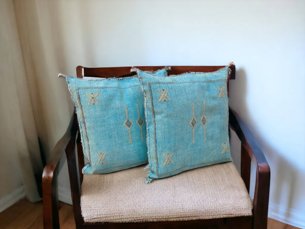 Handmade lumbar cushion with intricate Moroccan Sabra design, perfect for home decor.