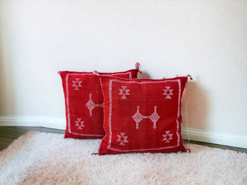 Handmade lumbar cushion with intricate Moroccan Sabra design, perfect for home decor.