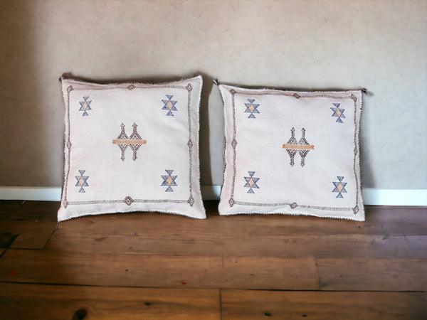 Handmade lumbar cushion with intricate Moroccan Sabra design, perfect for home decor.