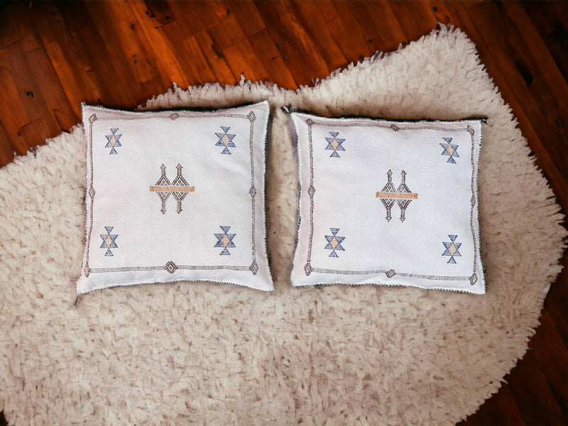 Handmade lumbar cushion with intricate Moroccan Sabra design, perfect for home decor.