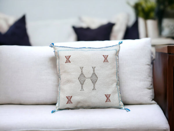 Handmade lumbar cushion with intricate Moroccan Sabra design, perfect for home decor.