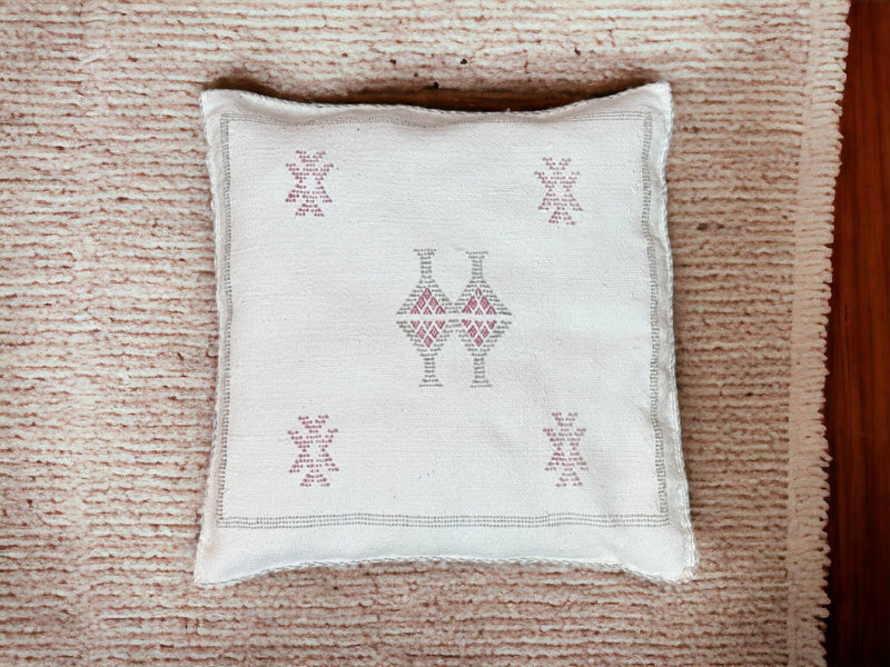 Handmade lumbar cushion with intricate Moroccan Sabra design, perfect for home decor.