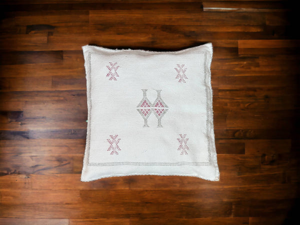 Handmade lumbar cushion with intricate Moroccan Sabra design, perfect for home decor.