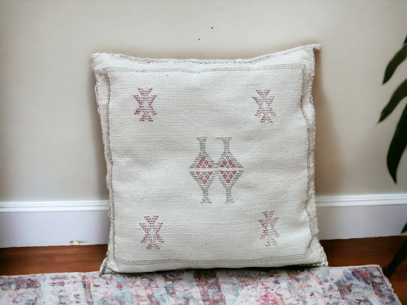 Handmade lumbar cushion with intricate Moroccan Sabra design, perfect for home decor.