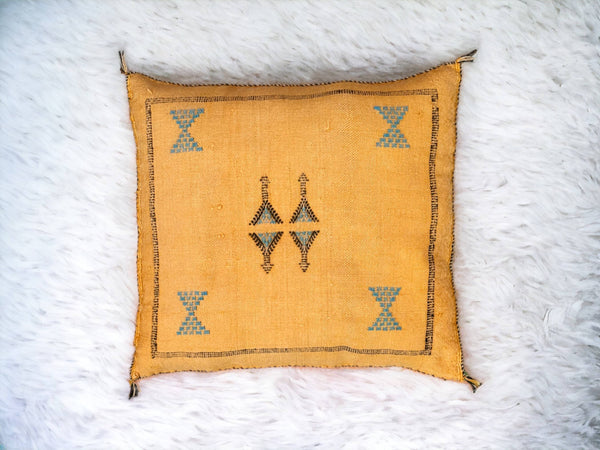 Handmade lumbar cushion with intricate Moroccan Sabra design, perfect for home decor.