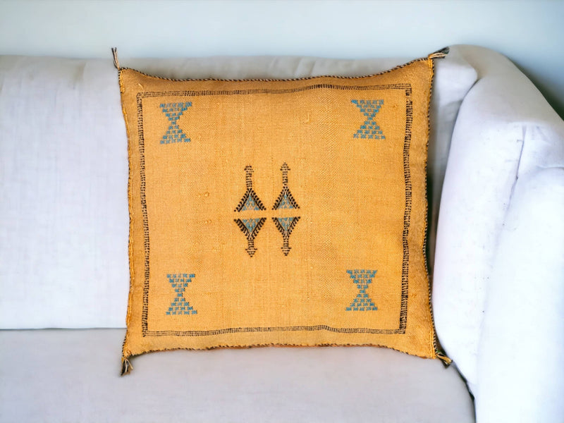 Handmade lumbar cushion with intricate Moroccan Sabra design, perfect for home decor.