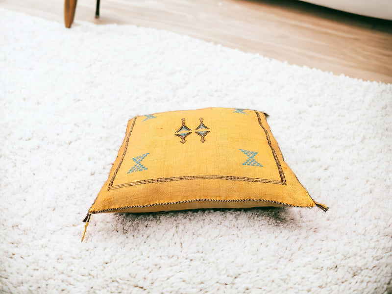 Handmade lumbar cushion with intricate Moroccan Sabra design, perfect for home decor.