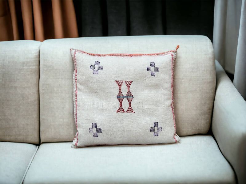 Handmade lumbar cushion with intricate Moroccan Sabra design, perfect for home decor.