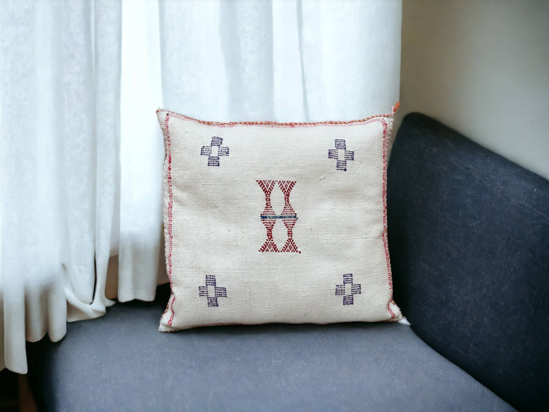 Handmade lumbar cushion with intricate Moroccan Sabra design, perfect for home decor.